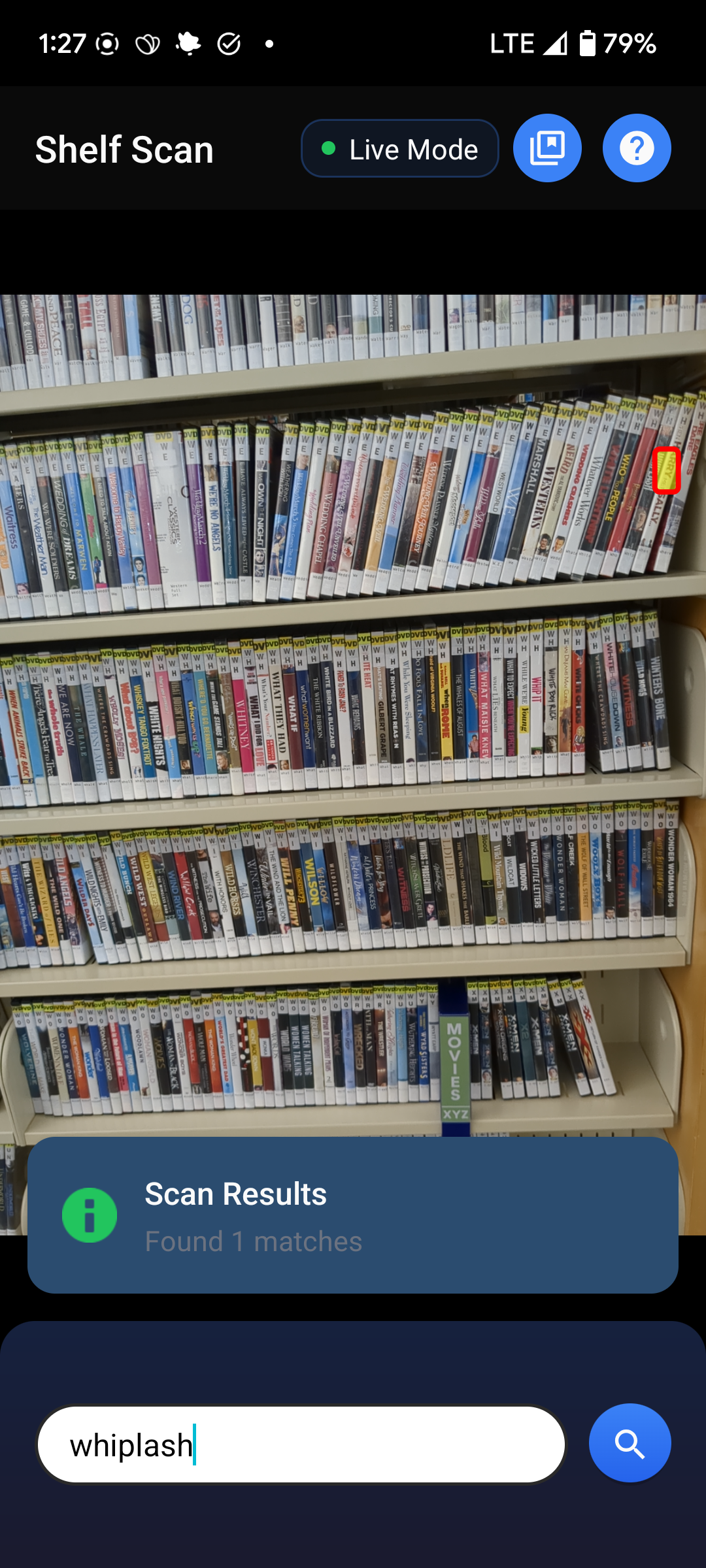 Shelf Scan Live Mode highlighting the spine of the movie Whiplash on a shelf