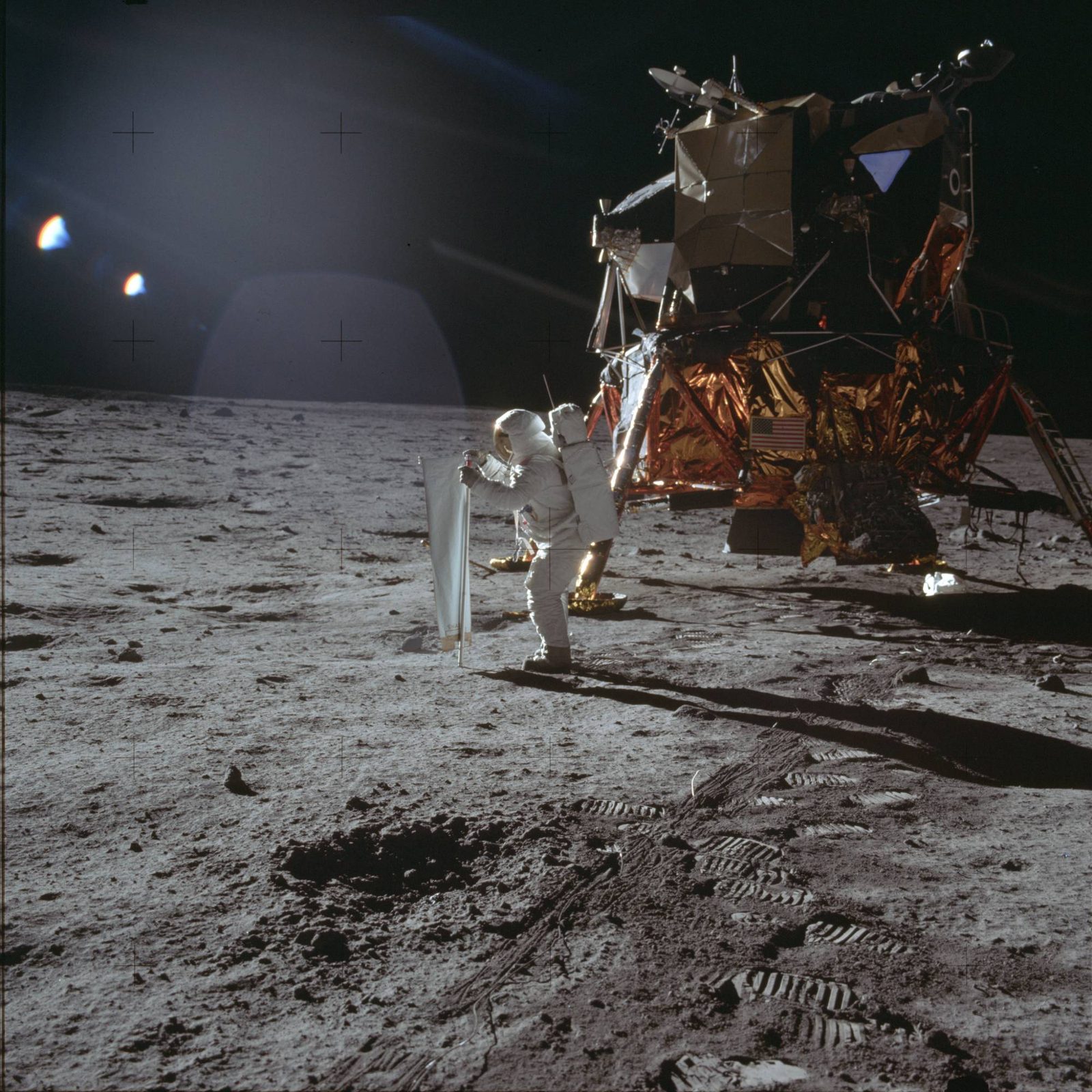 Aldrin deploying the Solar Wind Composition foil, the LM behind him (AS11-40-5872, NASA).