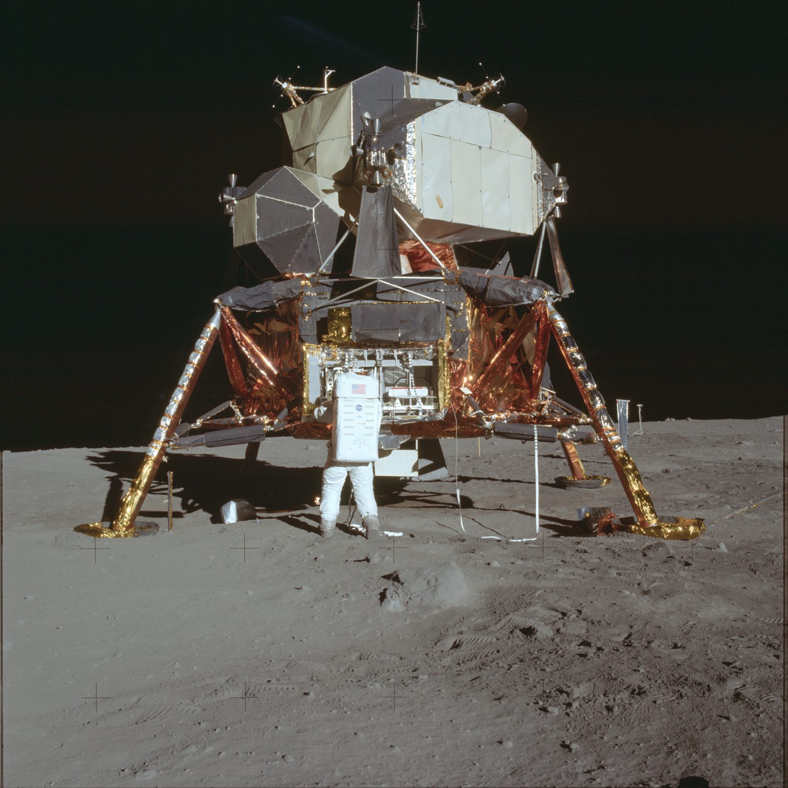 Aldrin at the front of the LM by the MESA work table, where samples were bagged and the rock boxes sealed (AS11-40-5927, NASA).