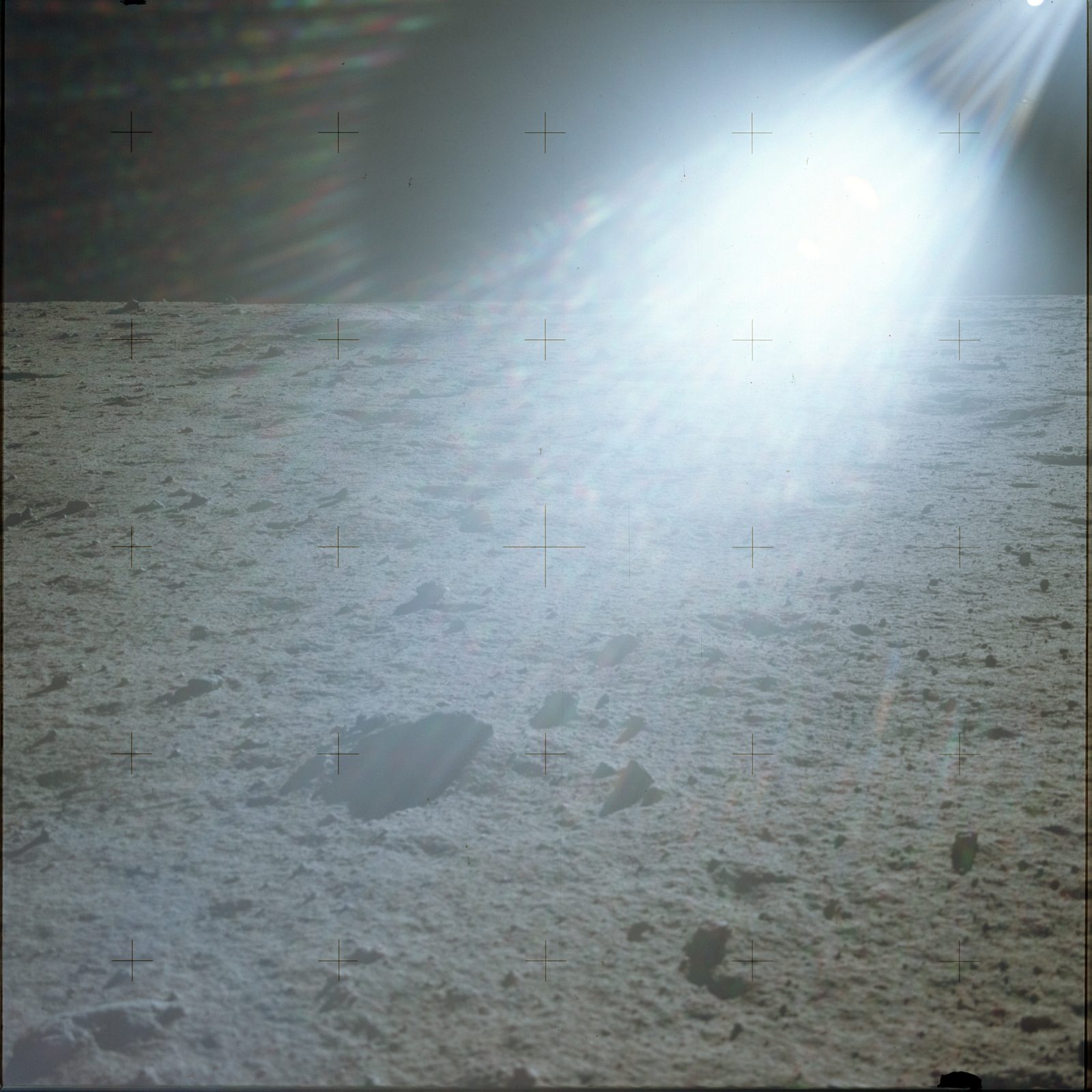 The mare surface at Tranquility Base facing east into the low Sun — the bright, washed-out down-Sun zone the crew described (AS11-40-5935, NASA).